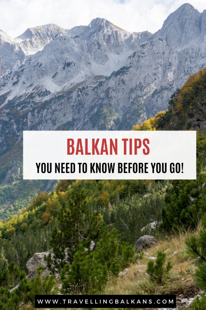A picturesque mountain range with rugged peaks and pine forests, with the overlay text "Balkan Tips: You Need to Know Before You Go!" and the website "www.travellingbalkans.com."