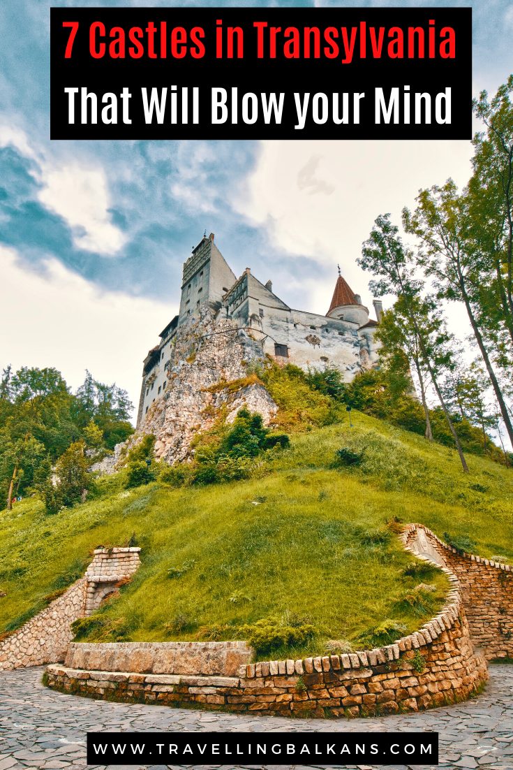 Dramatic uphill view of Bran Castle surrounded by greenery and cobblestone path, with text overlay: “7 Castles in Transylvania That Will Blow Your Mind.”